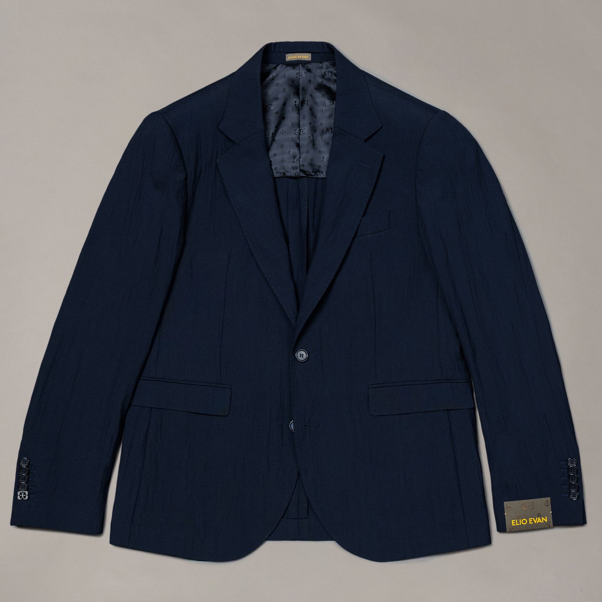 Giacca blu in lana stretch tinta unita di Elio Evan — silhouette rilassata