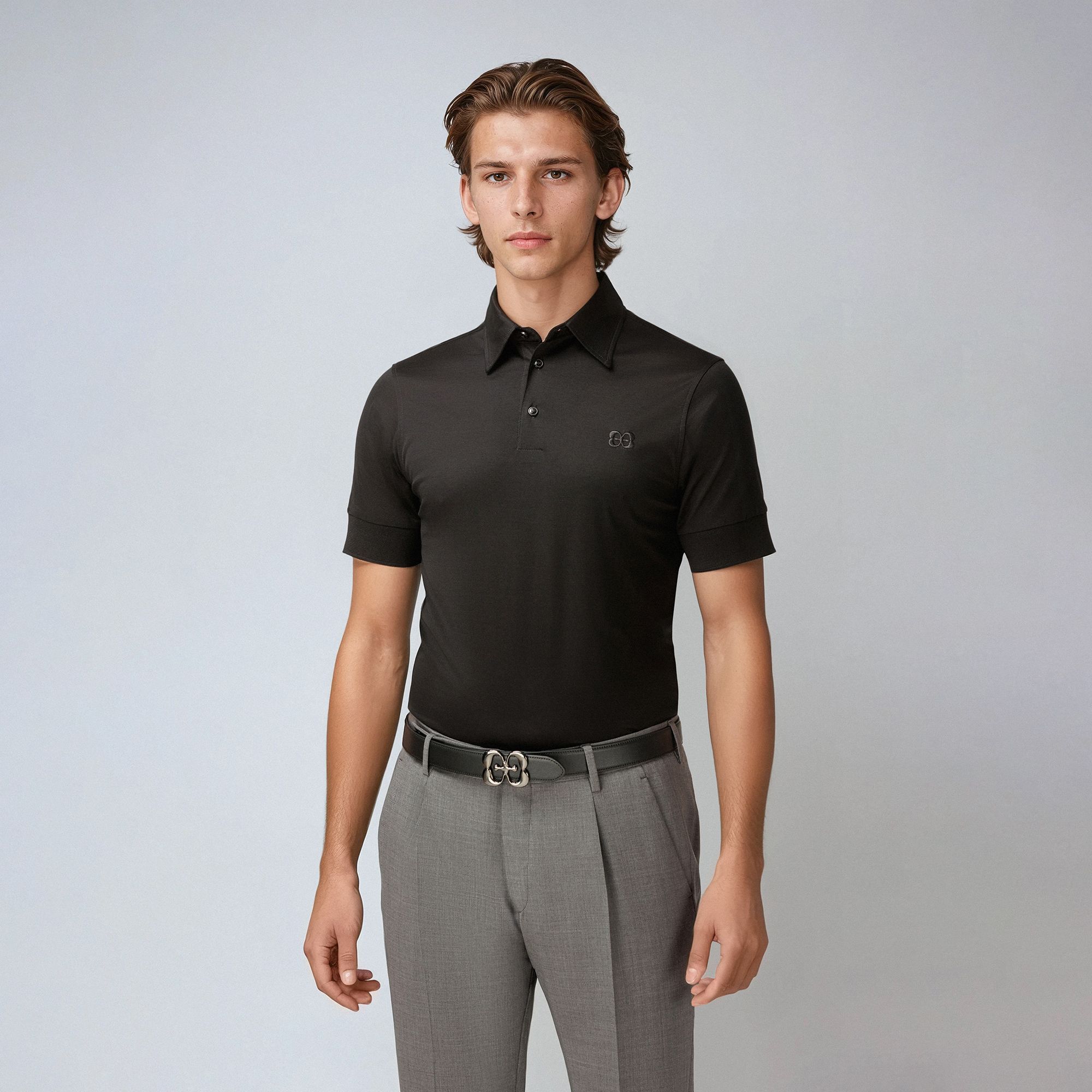 Polo uomo nera in cotone di Elio Evan, colletto camicia, costruzione paramontura, slim fit. Made in Italy.