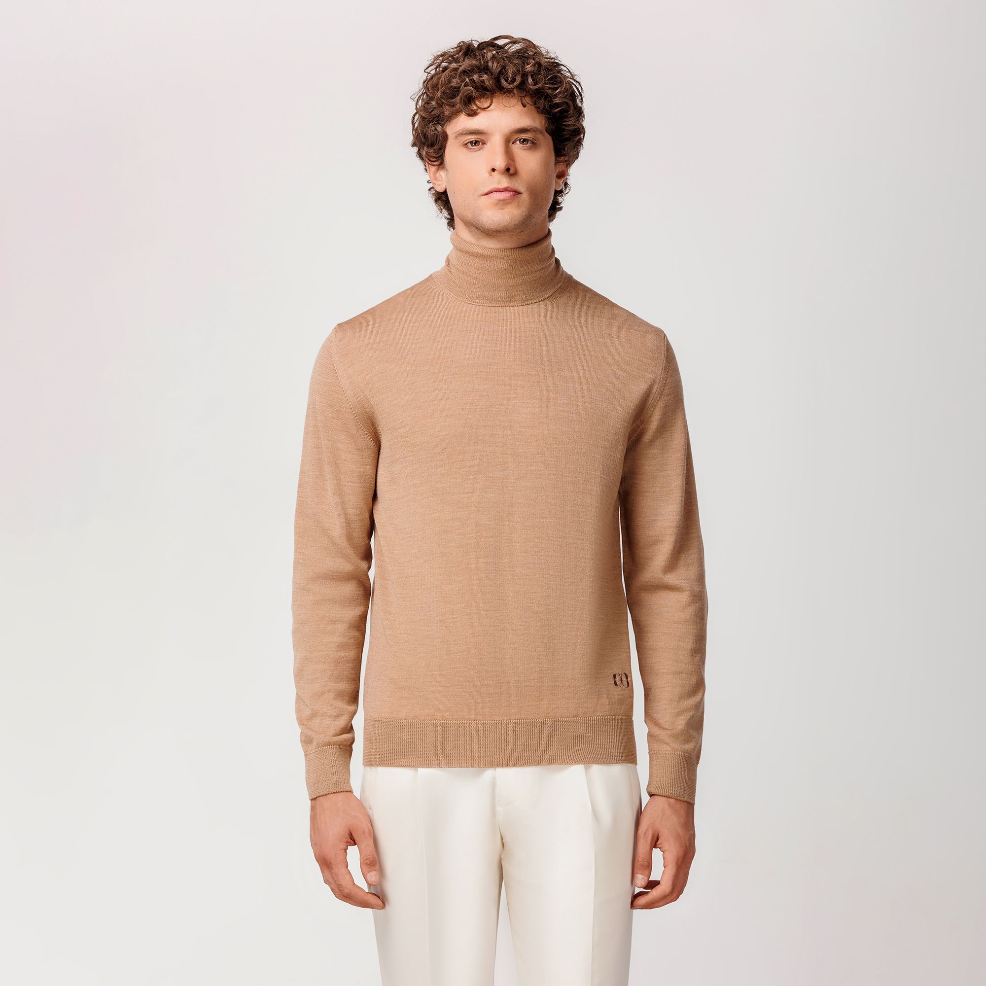 Camel rollneck sweater by Elio Evan, crafted from extrafine merino wool with ribbed hems and flawless fit.